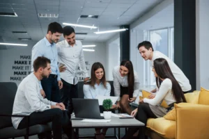 into-success-group-young-freelancers-office-have-conversation-smiling